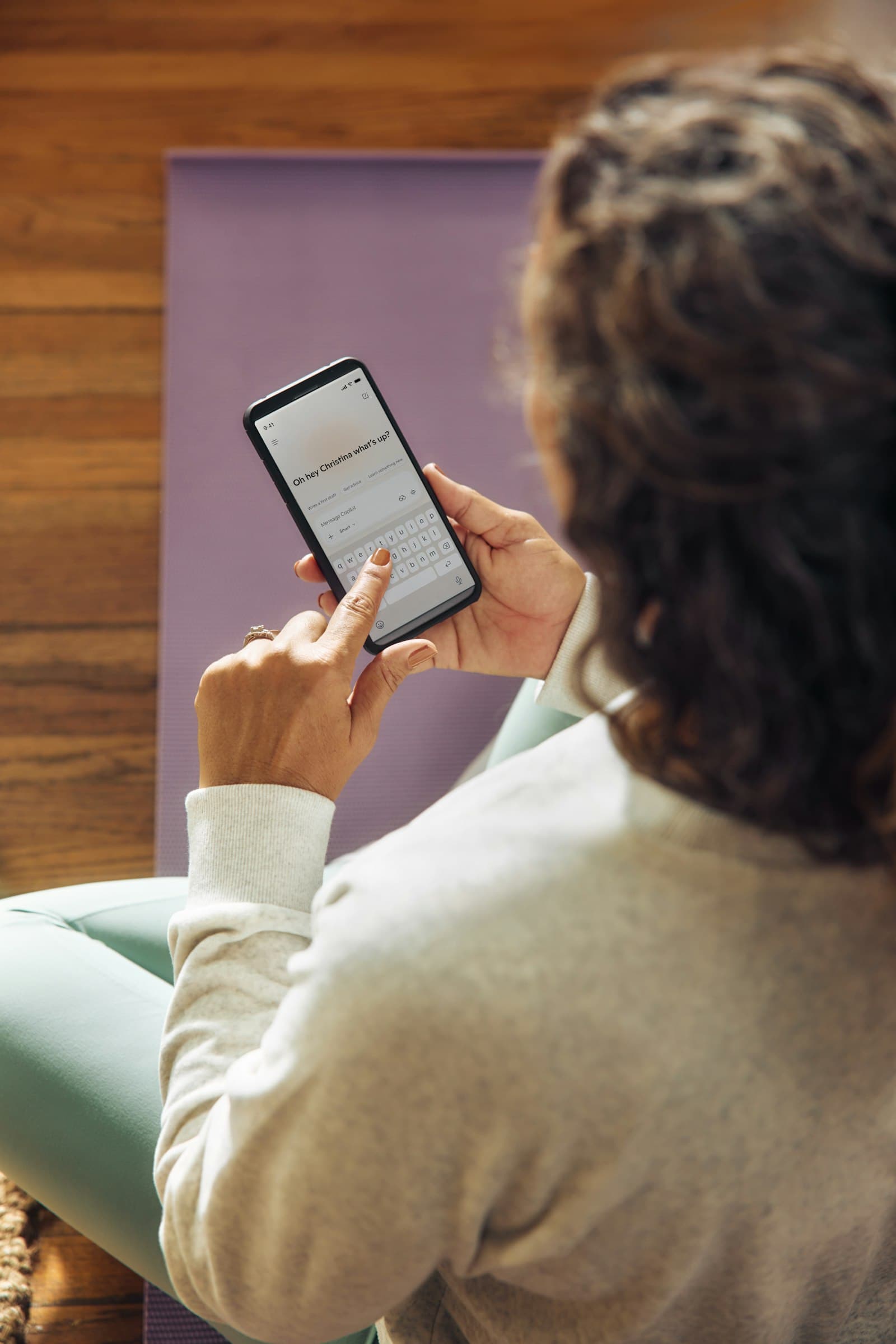 A woman reading on her phone
